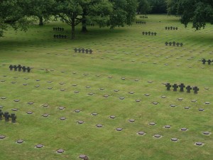 A section of the cemetary viewed from the Tumulus. The graves of Michael Wittmann and his crew lie just beyond the trees on the left