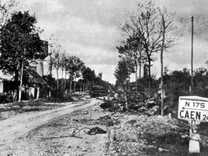 The view back down the RN 175 towards Caen. The trail of the morning's destruction is evident